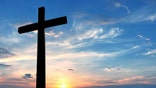 Christian cross over beautiful sky background concept of religion