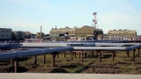 Shown here are oil and gas pipelines running into Alyeska's trans-Alaska oil pipeline pump station in Deadhorse, Alaska.