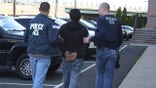 This photo provided by the U.S. Immigration and Customs Enforcement, Wednesday, March 28, 2012, in New Jersey,  shows agents taking a person into custody during operation Cross Check III. The Obama administration said it arrested more than 3,100 immigrants who were illegally in the country and who were convicted of serious crimes or otherwise considered fugitives or threats to national security. It was part of a six-day nationwide sweep that the government described as the largest of its kind. (AP Photo/U.S. Immigration and Customs Enforcement)