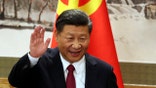 FILE - In this Oct. 25, 2017, file photo, Chinese President Xi Jinping waves while addressing the media as he introduced new members of the Politburo Standing Committee at Beijing's Great Hall of the People. China's official news agency said Sunday, Feb. 25, 2018, the ruling Communist Party proposed removing a limit of two consecutive terms for the country's president and vice president. The move, if approved, appears to lay the groundwork for party leader Xi to rule as president beyond 2023. (AP Photo/Ng Han Guan, File)
