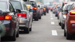 Cars in long row on highway in traffic jam