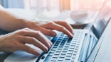 close up of hands of business person working on computer, man using internet and social media
