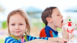 Two kids eating ice cream