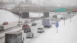 Motorist drive along a snow covered Interstate-94 in Detroit, Michigan January 2, 2014. The first major winter storm of 2014 bore down on the northeastern United States on Thursday with heavy snow, Arctic temperatures and strong winds just as many people were returning from holiday breaks. REUTERS/Joshua Lott (UNITED STATES - Tags: ENVIRONMENT) - TM4EA1212DN01