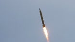 EDITORS' NOTE: Reuters and other foreign media are subject to Iranian restrictions on their ability to film or take pictures in Tehran.A Ghadr 1 class Shahab 3 long range missile is launched during a test from an unknown location in central Iran September 28, 2009. Iran test-fired the missile on Monday which defence analysts have said could hit Israel and U.S. bases in the Gulf, state media reported, a move that may irk world powers ahead of rare talks with Tehran this week. REUTERS/Fars News/Ali Shayegan (IRAN MILITARY POLITICS) QUALITY FROM SOURCE - GM1E59S1FIM01