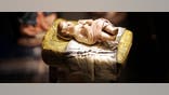 WASHINGTON - DECEMBER 9:  A scuplture of a baby Jesus that is part of a nativity scene from Spain is displayed during a "Joy to the World"  exhibit December 9, 2004 in Washington, DC. More than 150 nativity scenes from around the world will be displayed during the fourth annual international creche exhibit running through January 10, 2004.  (Photo by Joe Raedle/Getty Images)