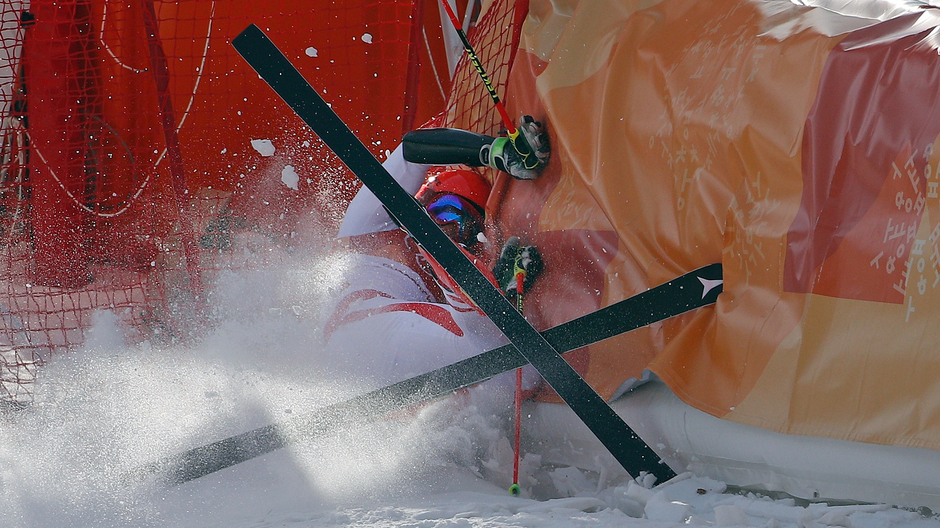 Austria's Manuel Feller crashes during the first run of the men's giant slalom at the 2018 Winter Olympics in Pyeongchang