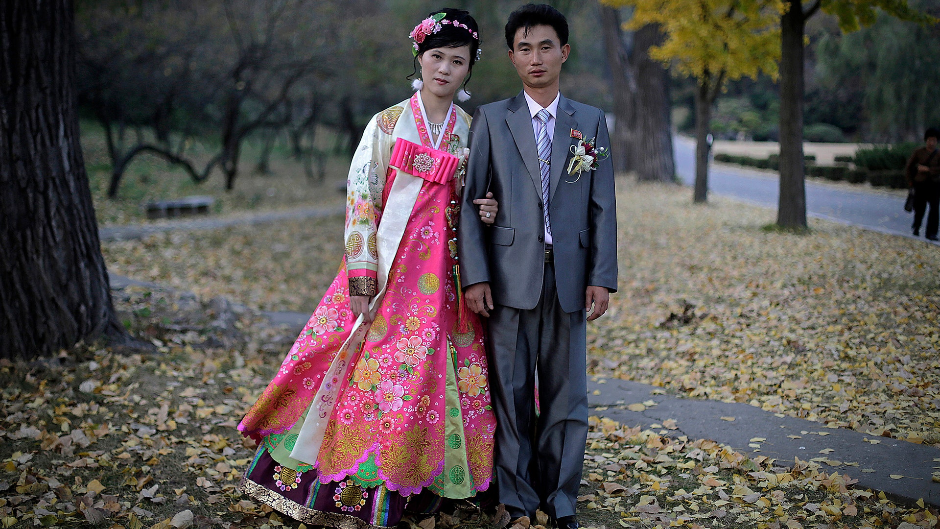 North Korean bride Ri Ok Ran, 28, and groom Kang Sung Jin, 32, pose for a portrait in Pyongyang, North Korea, October 14, 2014