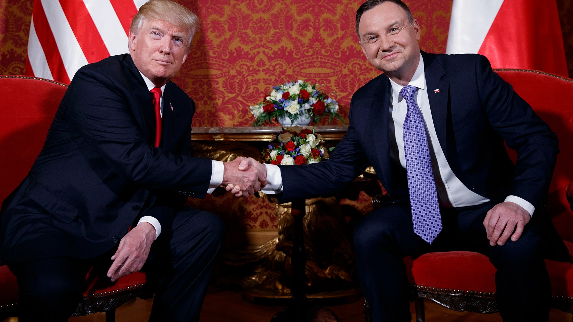 President Donald Trump and Polish President Andrzej Duda shake hands at the Royal Castle, Thursday, July 6, 2017, in Warsaw