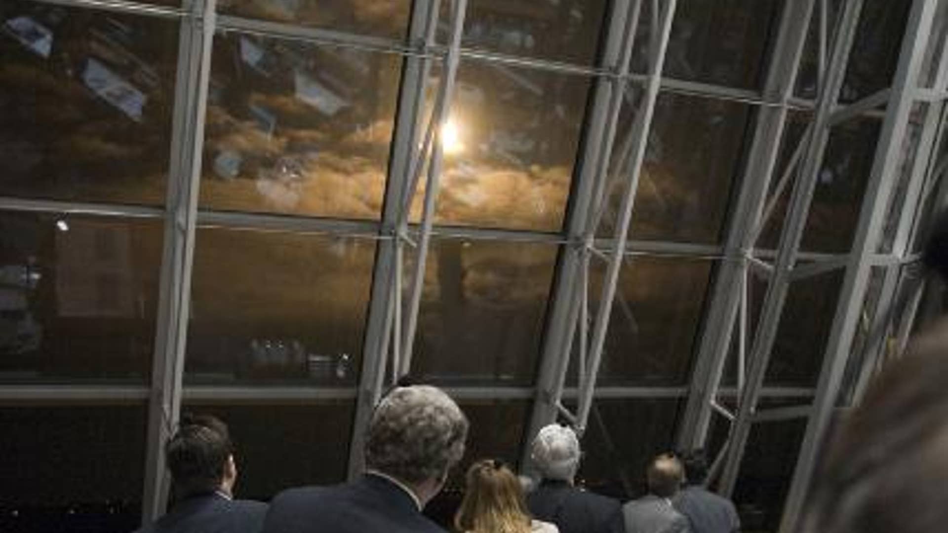 ...And the World Looks On...