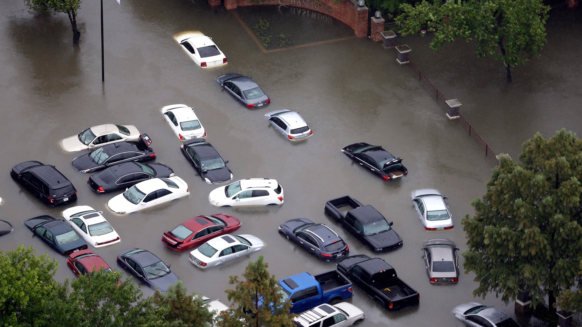 Flooded cars near the Addicks Reservoir are shown as floodwaters from Tropical Storm Harvey rise Tuesday, in Houston