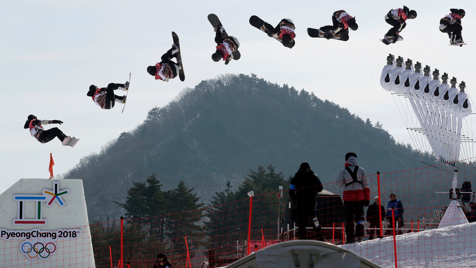  Laurie Blouin of Canada, seen in a multiple exposure image, jumps during qualification for the women's Big Air snowboard competition