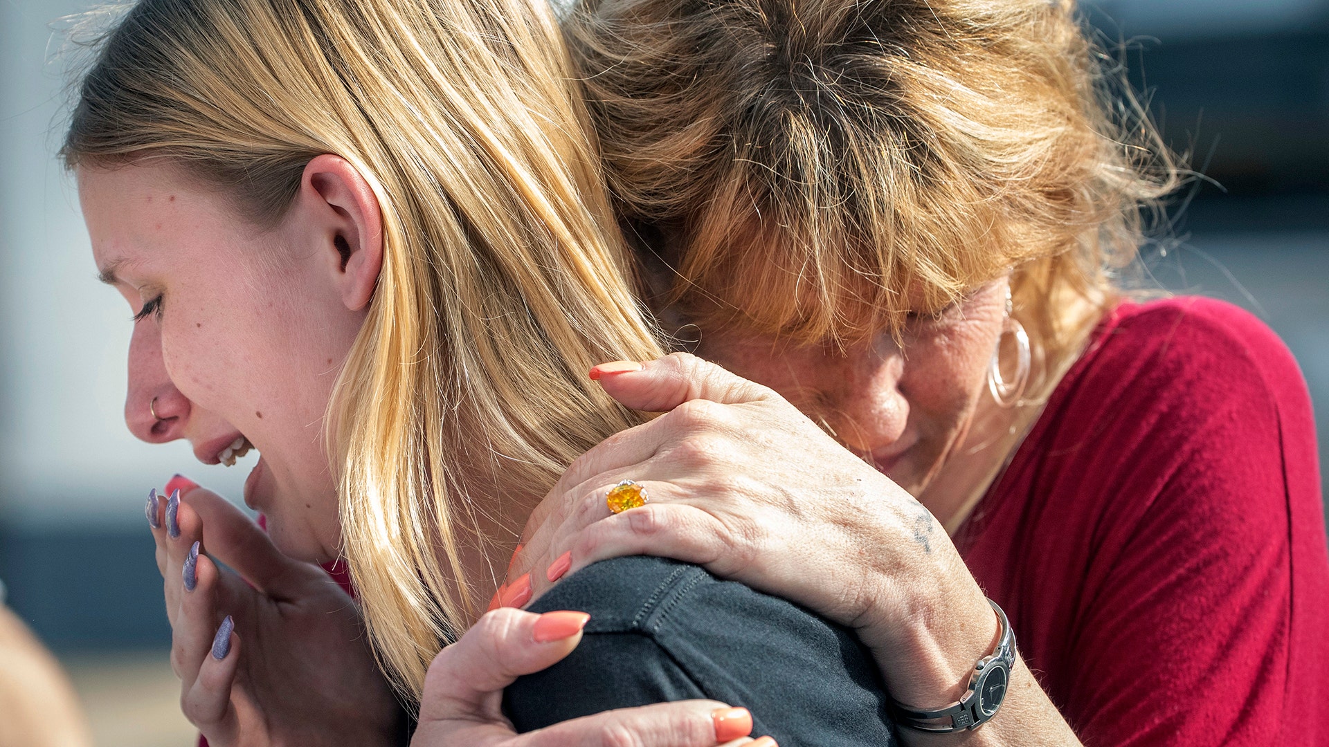Santa Fe High School student Dakota Shrader is comforted by her mother Susan Davidson following a shooting at the school, May 18, 2018