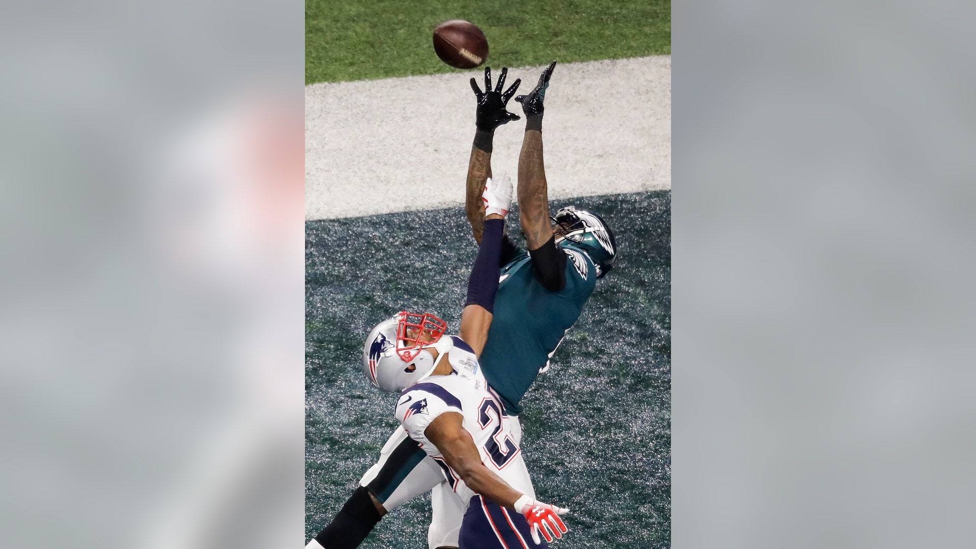 Philadelphia Eagles Alshon Jeffery catches a touchdown pass over New England Patriots Eric Rowe in the first quarter of Super Bowl 52