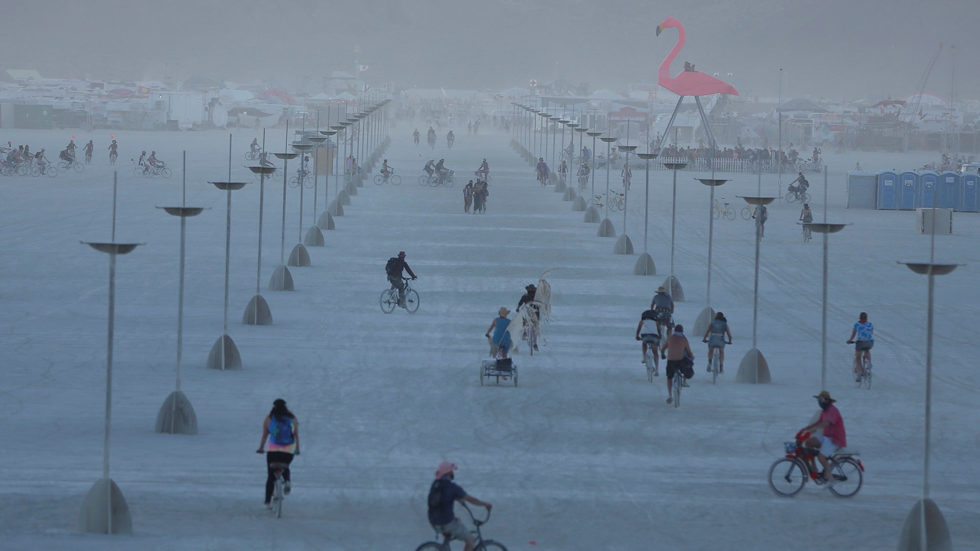 Participants explore the playa at the annual Burning Man arts and music festival in the Black Rock Desert of Nevada, August 28