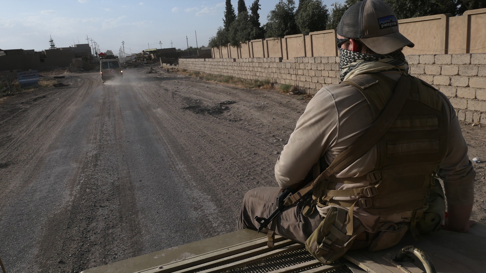 Ephraim Mattos riding on the hood of a Humvee, June 1, 2017