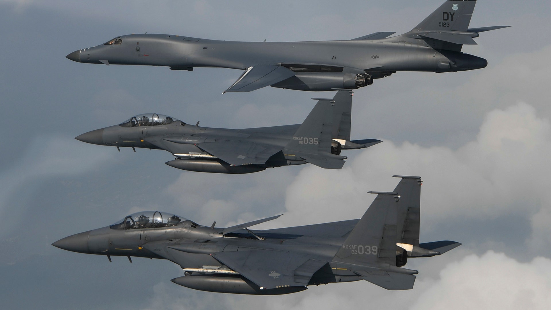 A U.S. Air Force B-1B Lancer is joined by Republic of Korea Air Force F-15 jets during a 10-hour training mission over the Korean Peninsula