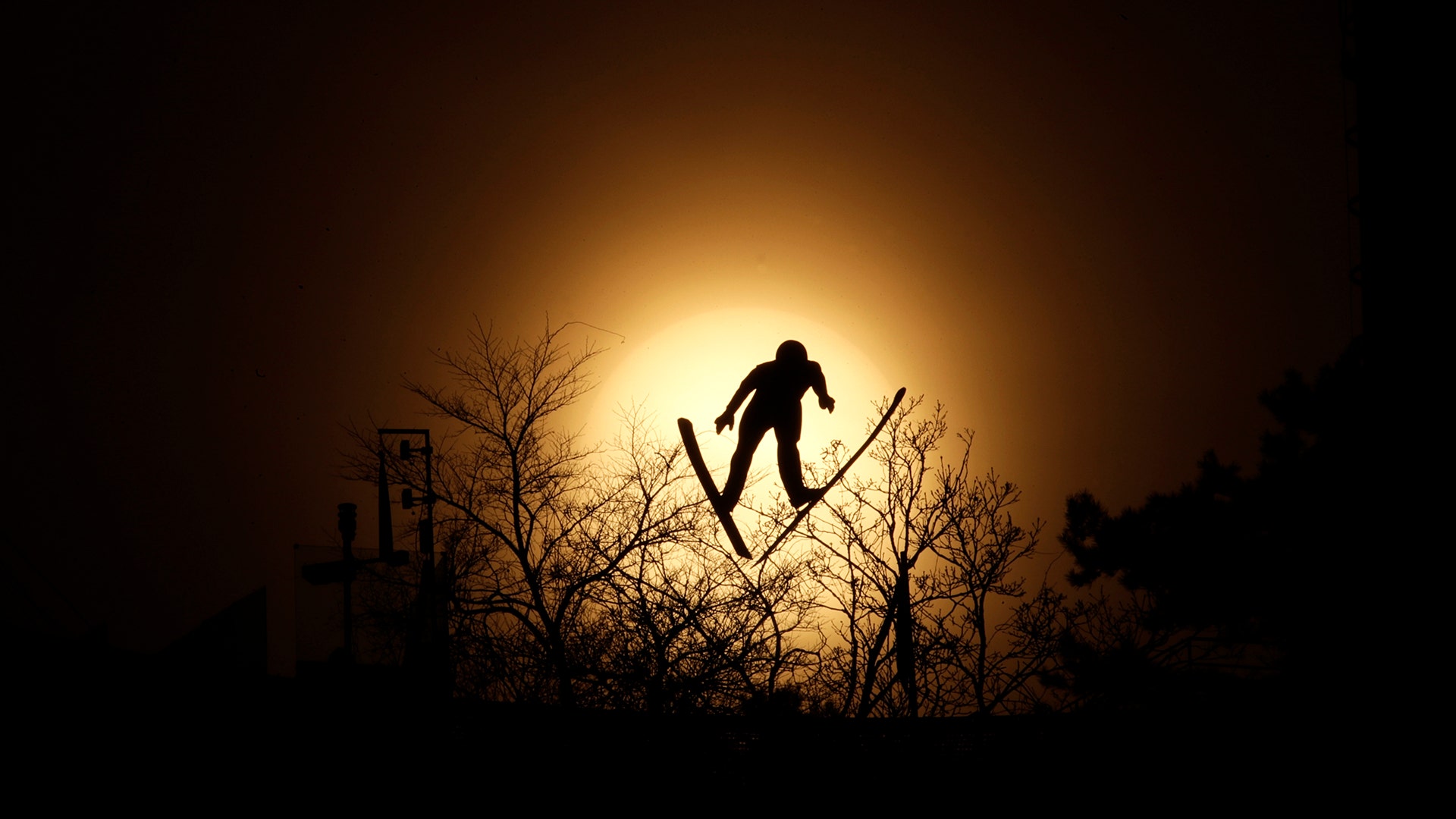 Lukas Runggaldier of Italy, soars through the air during training for the nordic combined competition at the 2018 Winter Olympics
