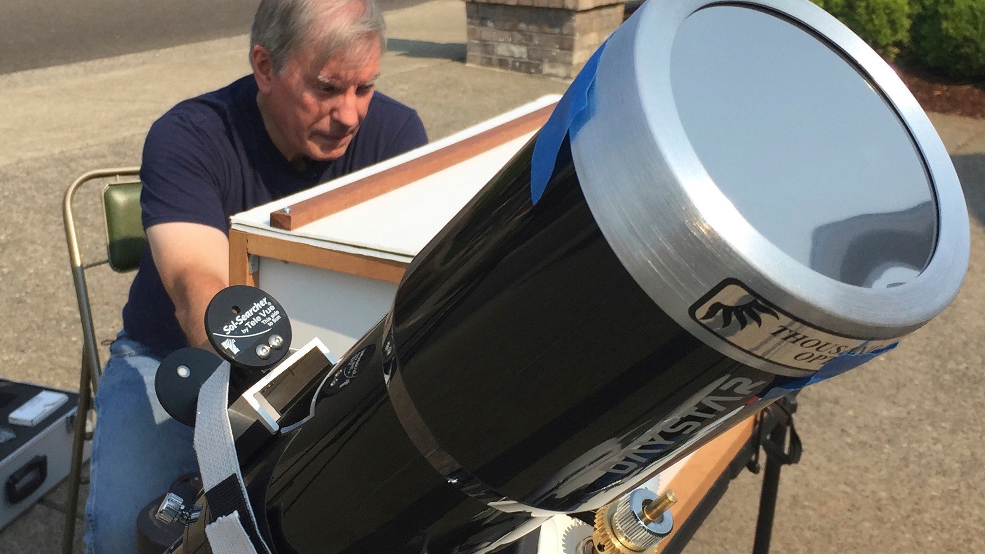 Amateur astronomer Mike Conley practices with the telescope he will use to document the total solar eclipse, at his home in Salem, Oregon