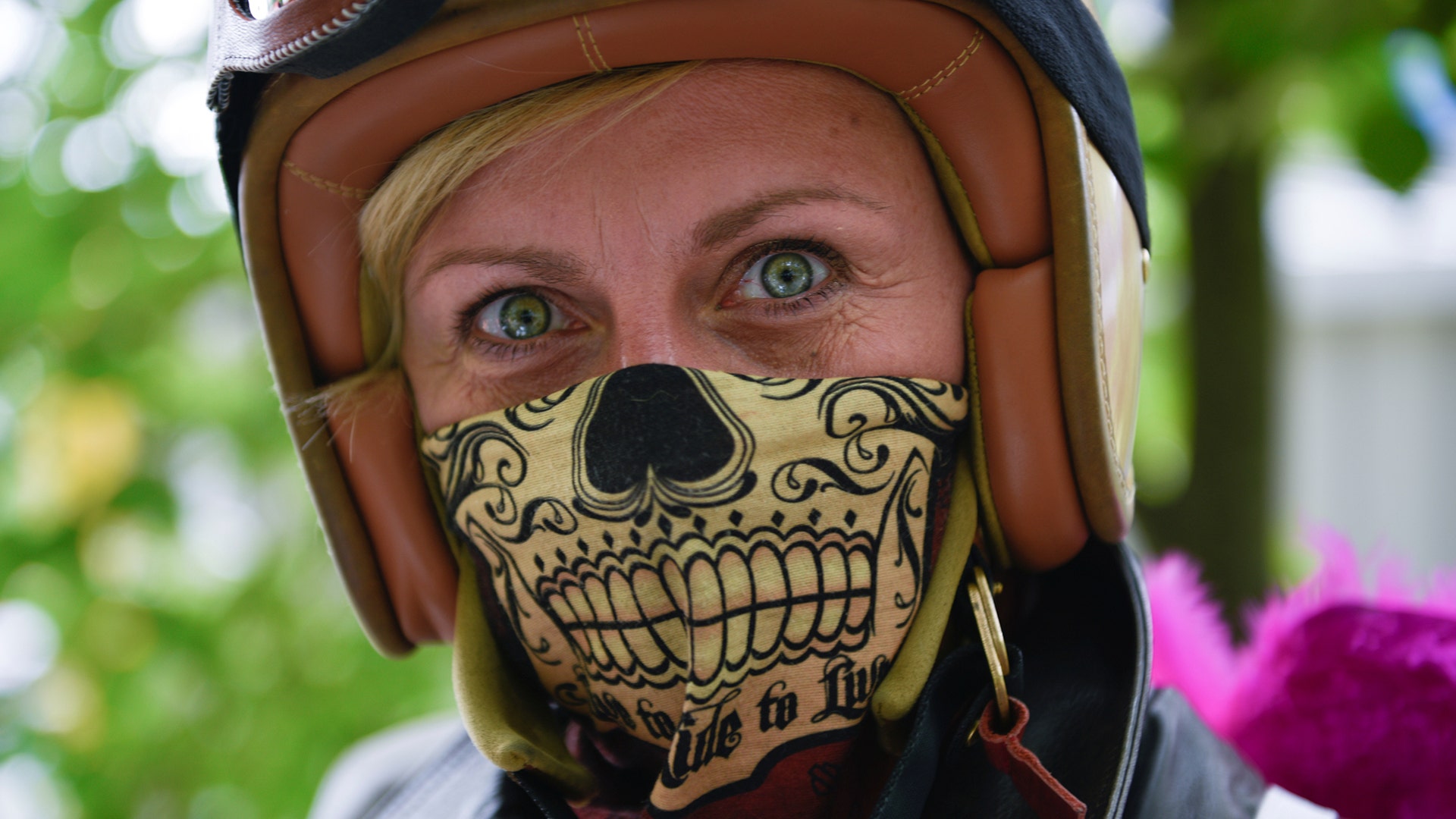 A participant poses during a motorbike race at the women-only Petrolettes motorcycle festival in Neuhardenberg, Germany