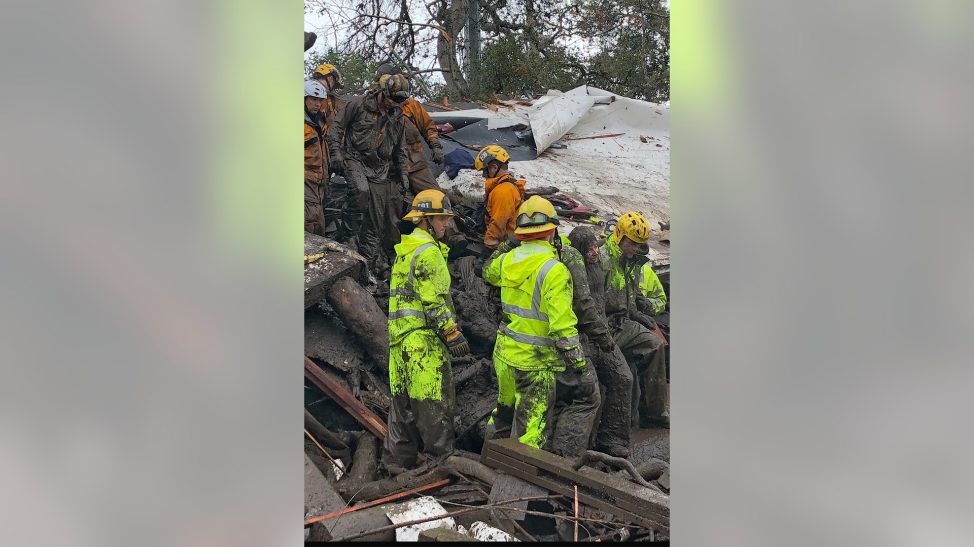 Emergency personnel rescue a 14-year-old girl from a house after a mudslide in Montecito, California, January 9, 2018