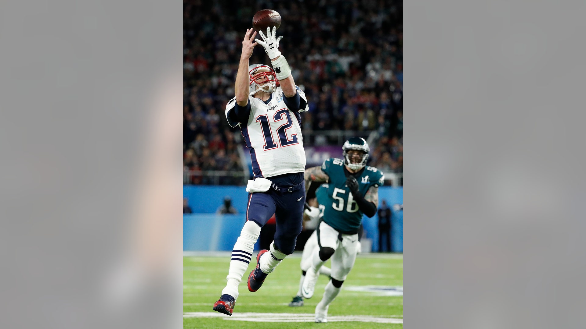 New England Patriots quarterback Tom Brady can't catch a pass on a flea flicker during the first half of Super Bowl 52 in Minneapolis