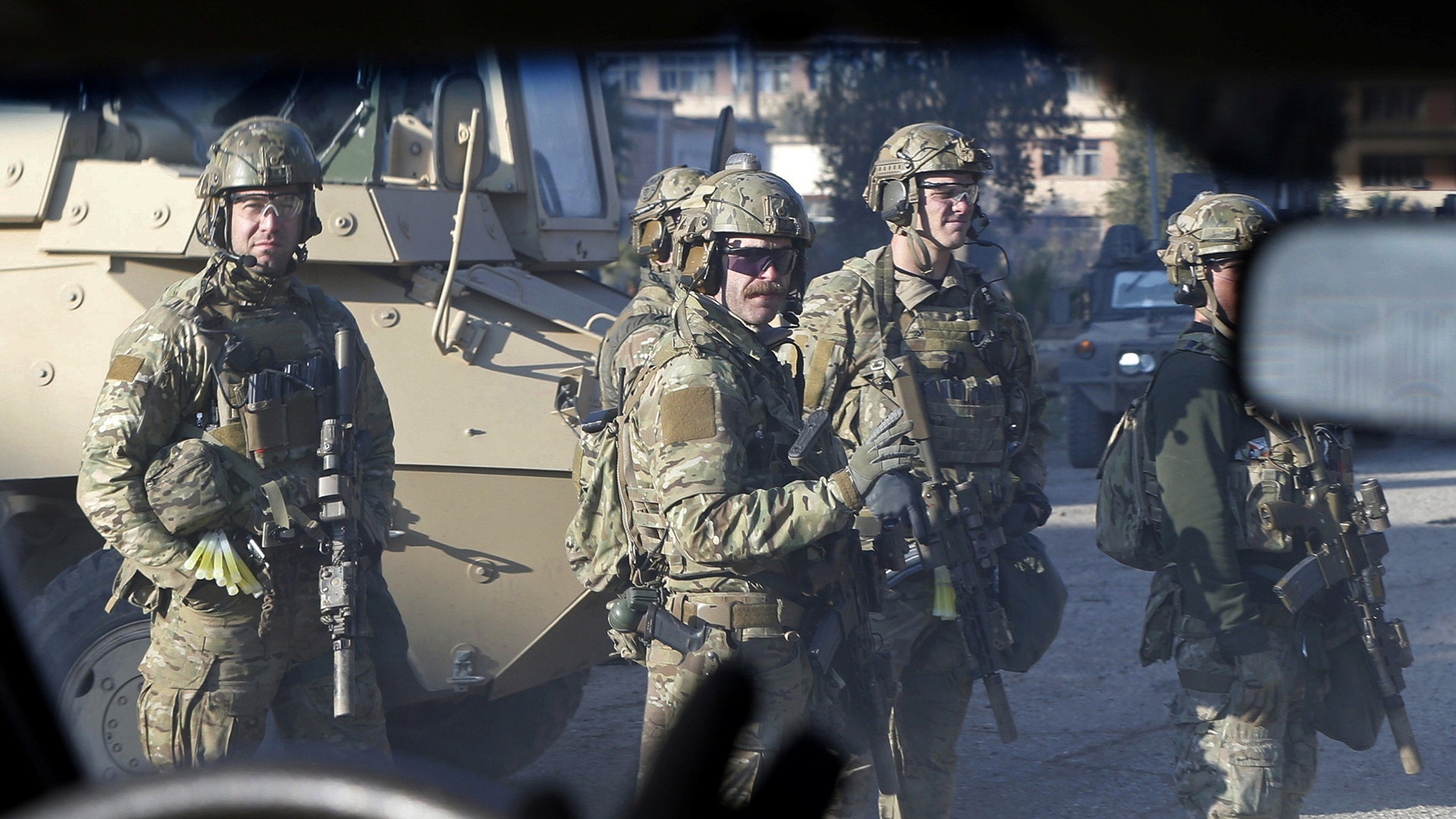 American army personnel gather at the University of Mosul during a battle with Islamic State militants in Mosul, Iraq, January 18, 2017