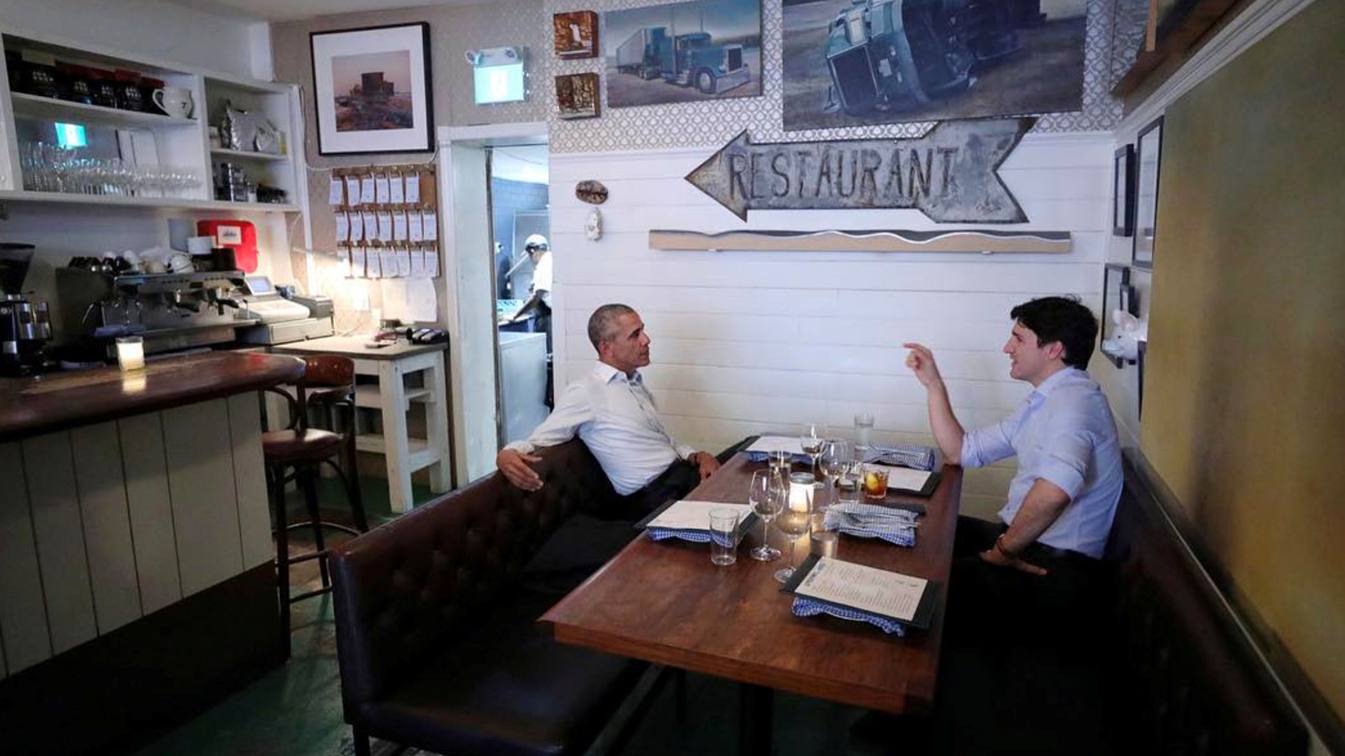 Canada's Prime Minister Justin Trudeau speaks with former President Barack Obama at a restaurant in Montreal, Canada June 5, 2017