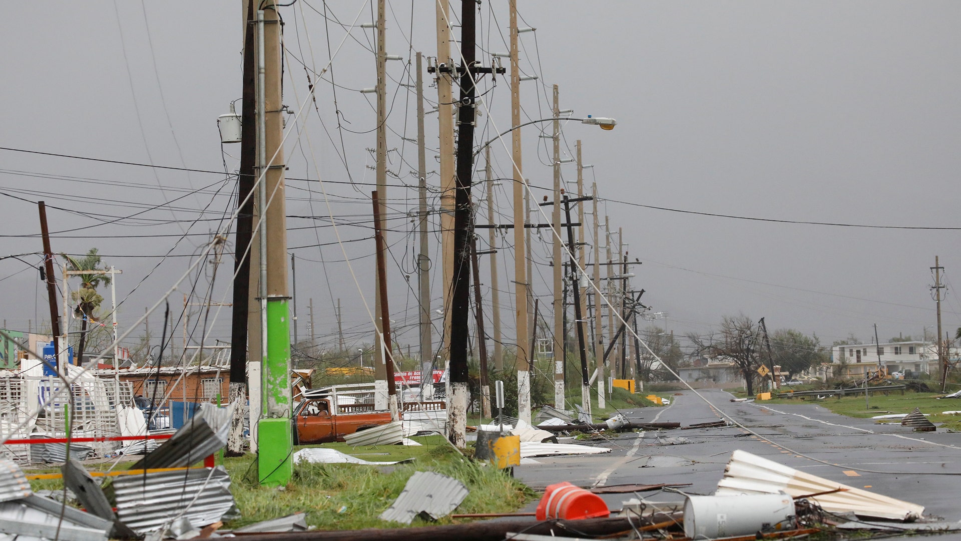Debris and damaged electrical installations are seen after the area was hit by Hurricane Maria en Guayama, Puerto Rico, Wednesday