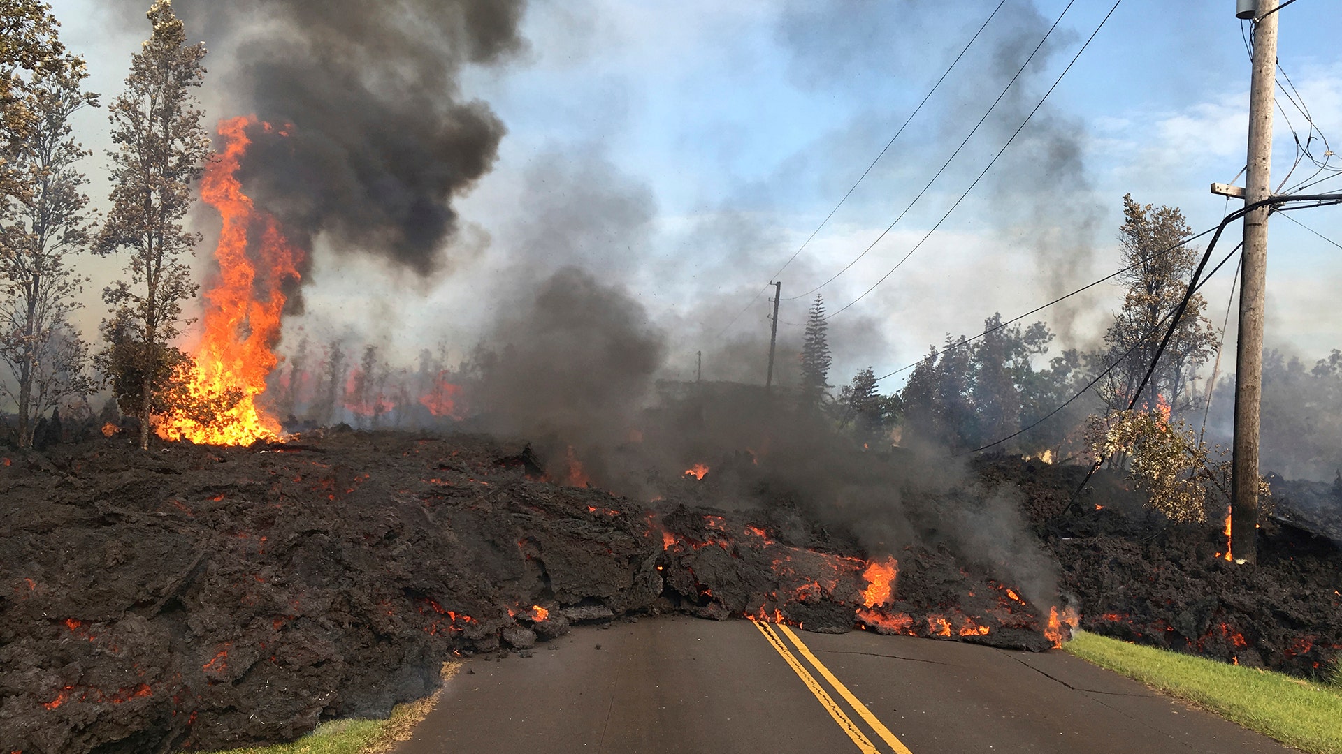 Lava from Fissure 7 slowly advances to the northeast on Hookapu Street in the Leilani Estates subdivision in Pahoa, Hawaii,. May 5, 2018