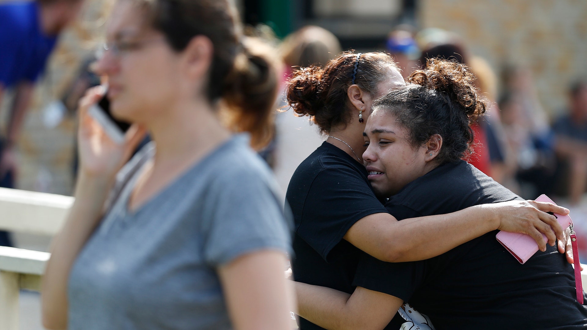 Santa Fe High School junior Guadalupe Sanchez cries in the arms of her mother after a shooting at the school, May 18, 2018
