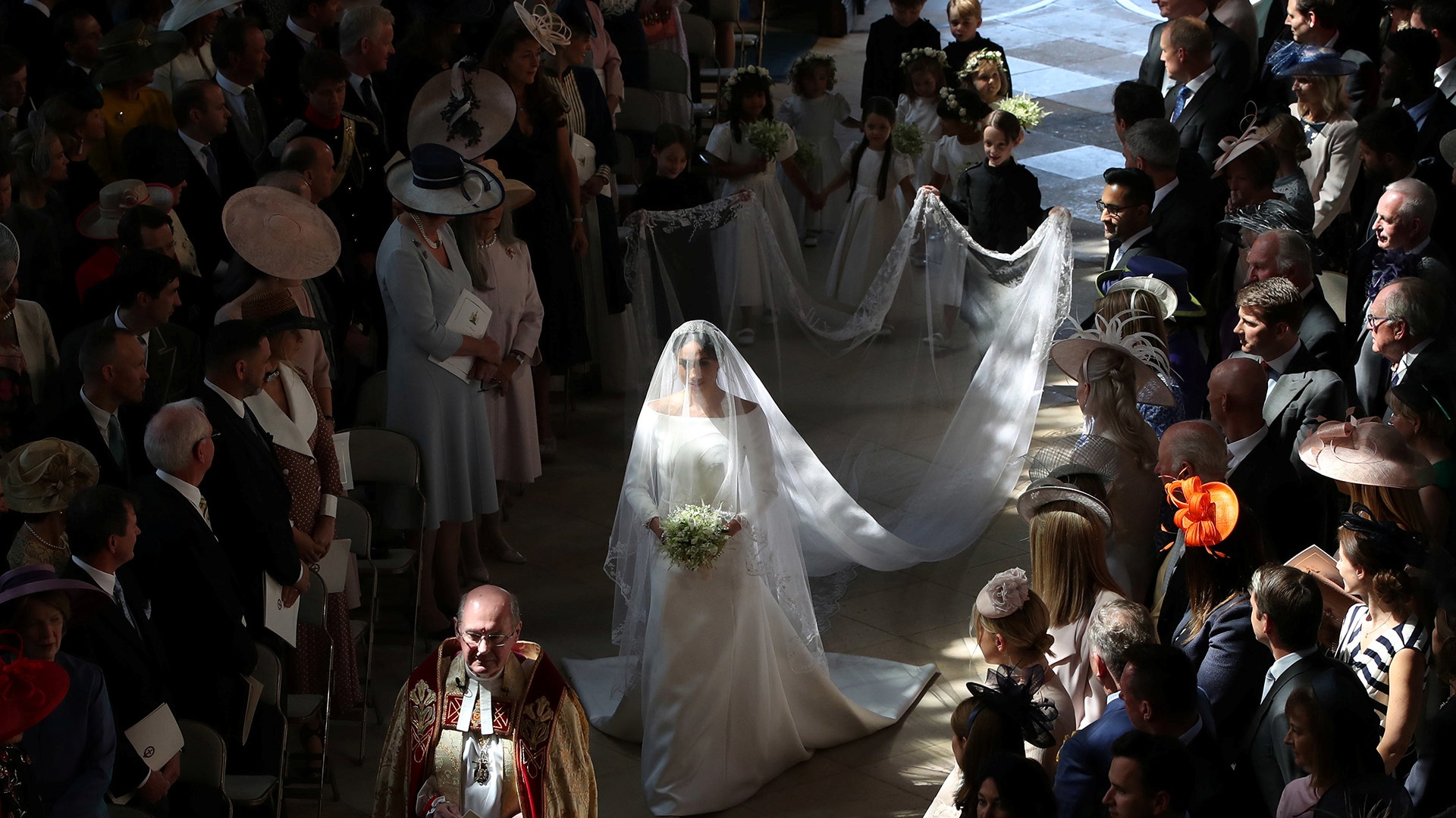 Meghan Markle walks down the aisle as she arrives in St George's Chapel at Windsor Castle