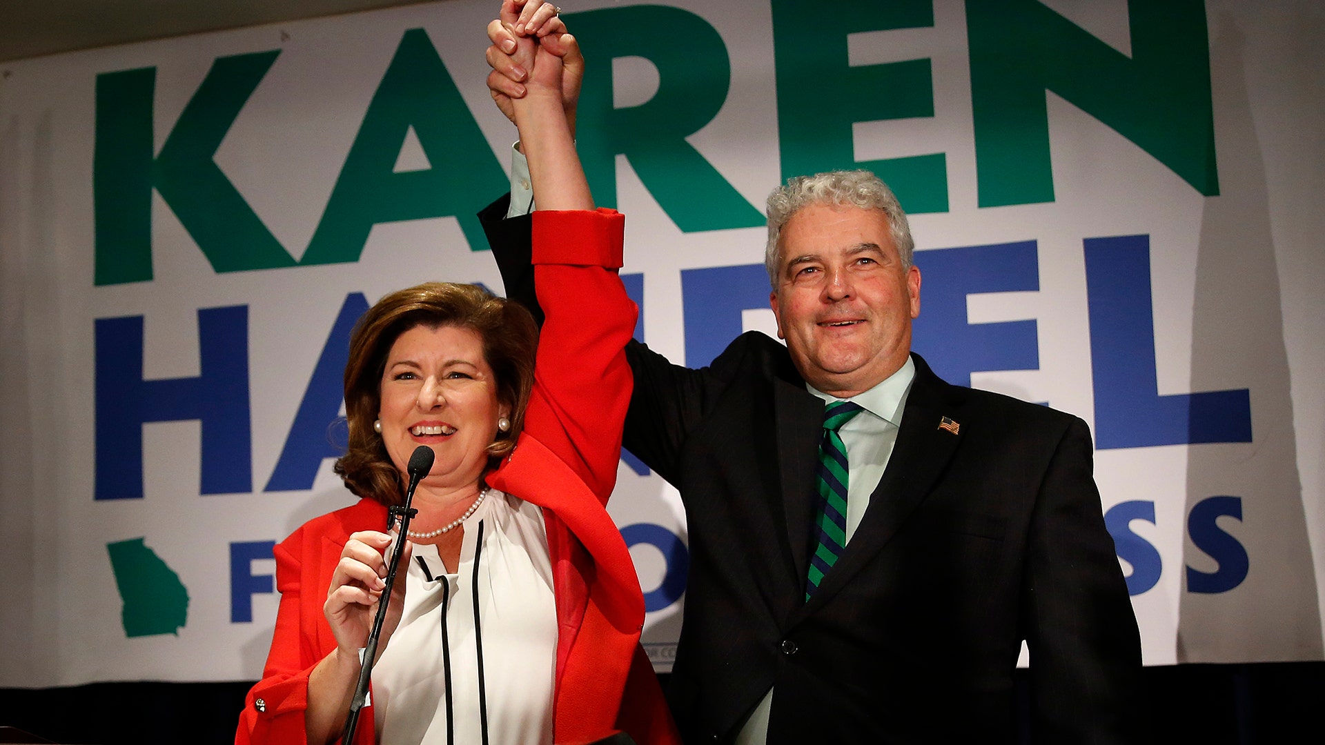 Republican candidate for Georgia's 6th District Congressional seat Karen Handel celebrates with her husband Steve as she declares victory