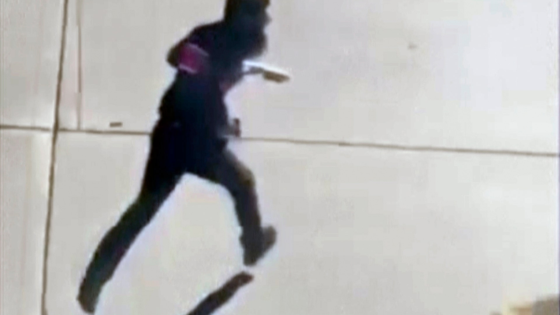 Terror attack suspect Sayfullo Saipov runs across the street with a fake gun in each hand in New York City, October 31