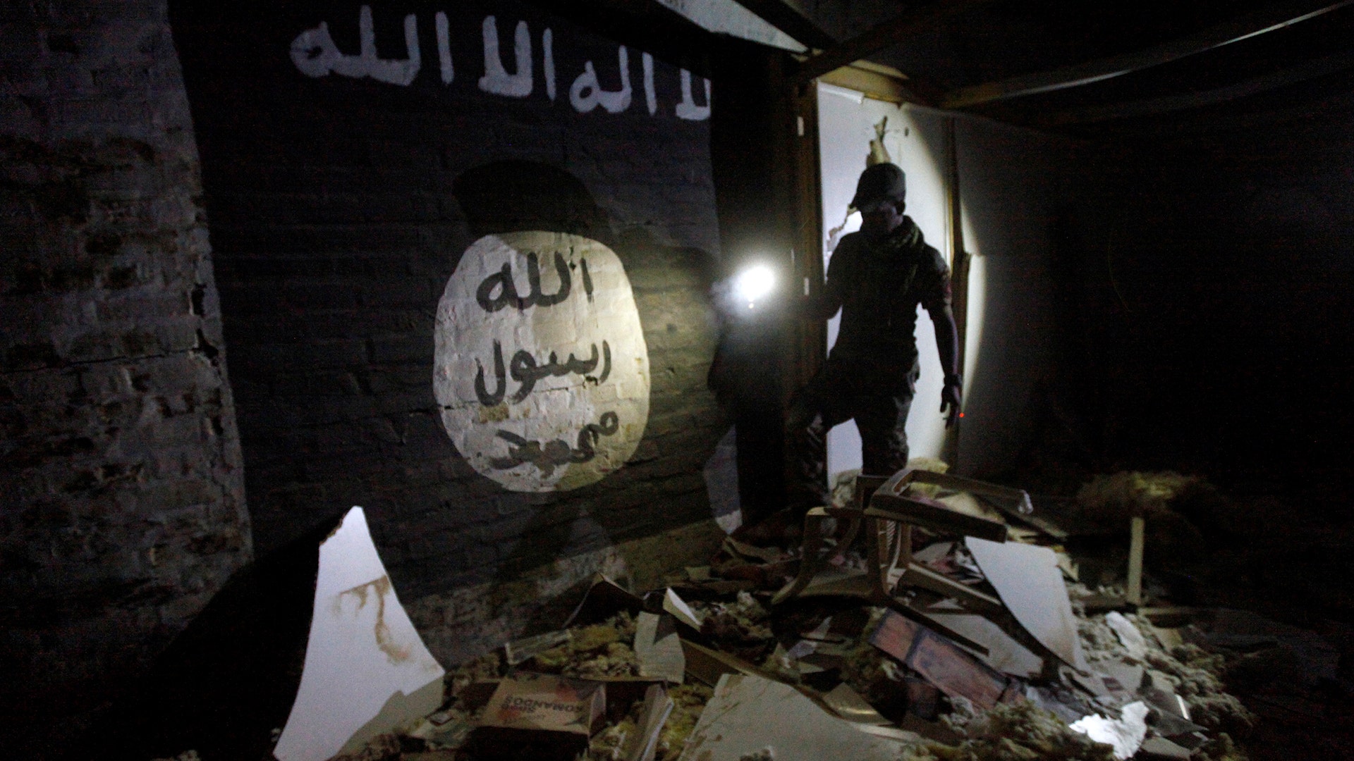 Islamic State slogans on the walls of a tunnel used by Islamic State militants as an underground training camp in Mosul, Iraq, March 4, 2017