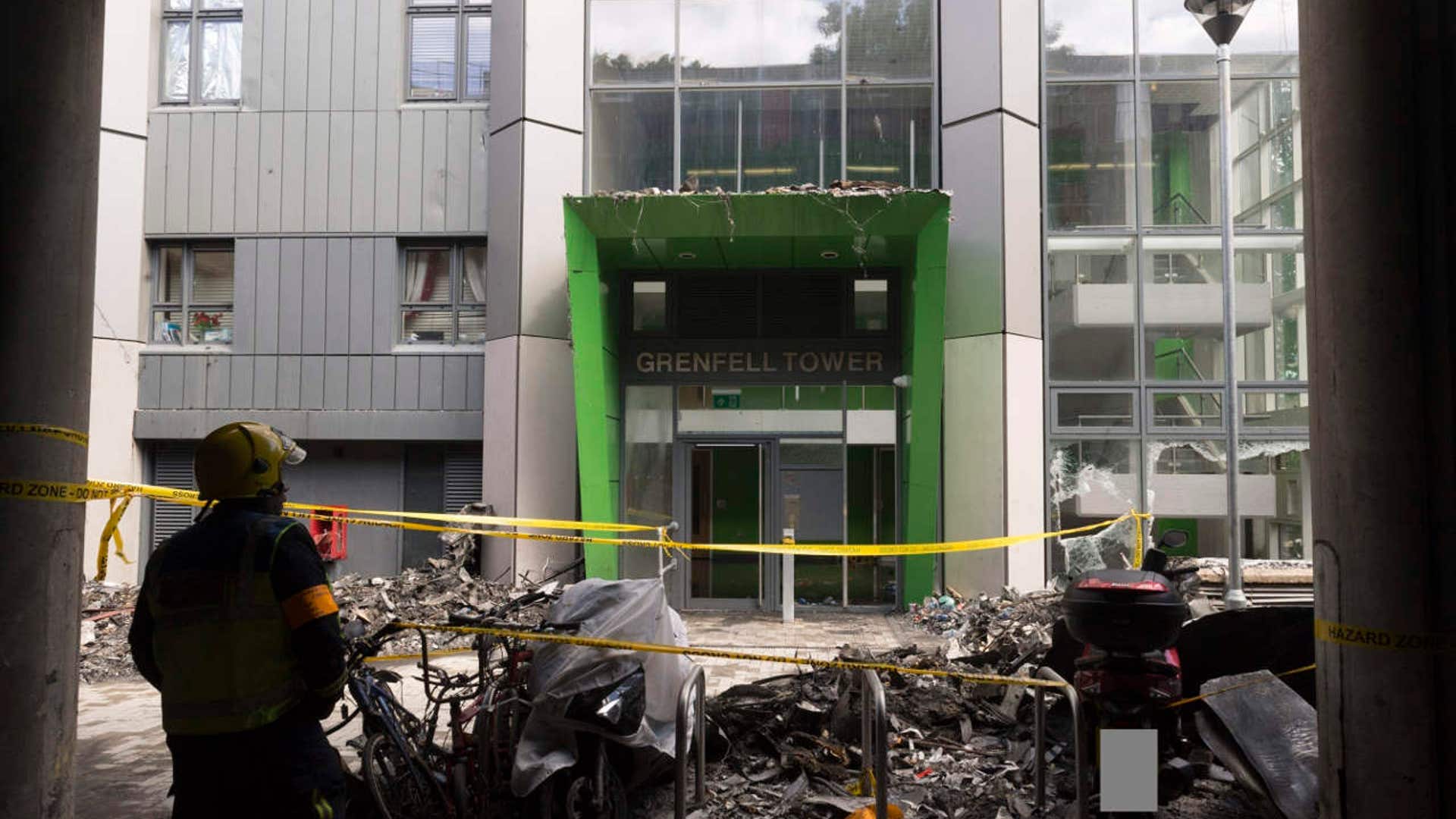 Photo released by the Metropolitan Police shows a firefighter outside of the Grenfell Tower fire in London
