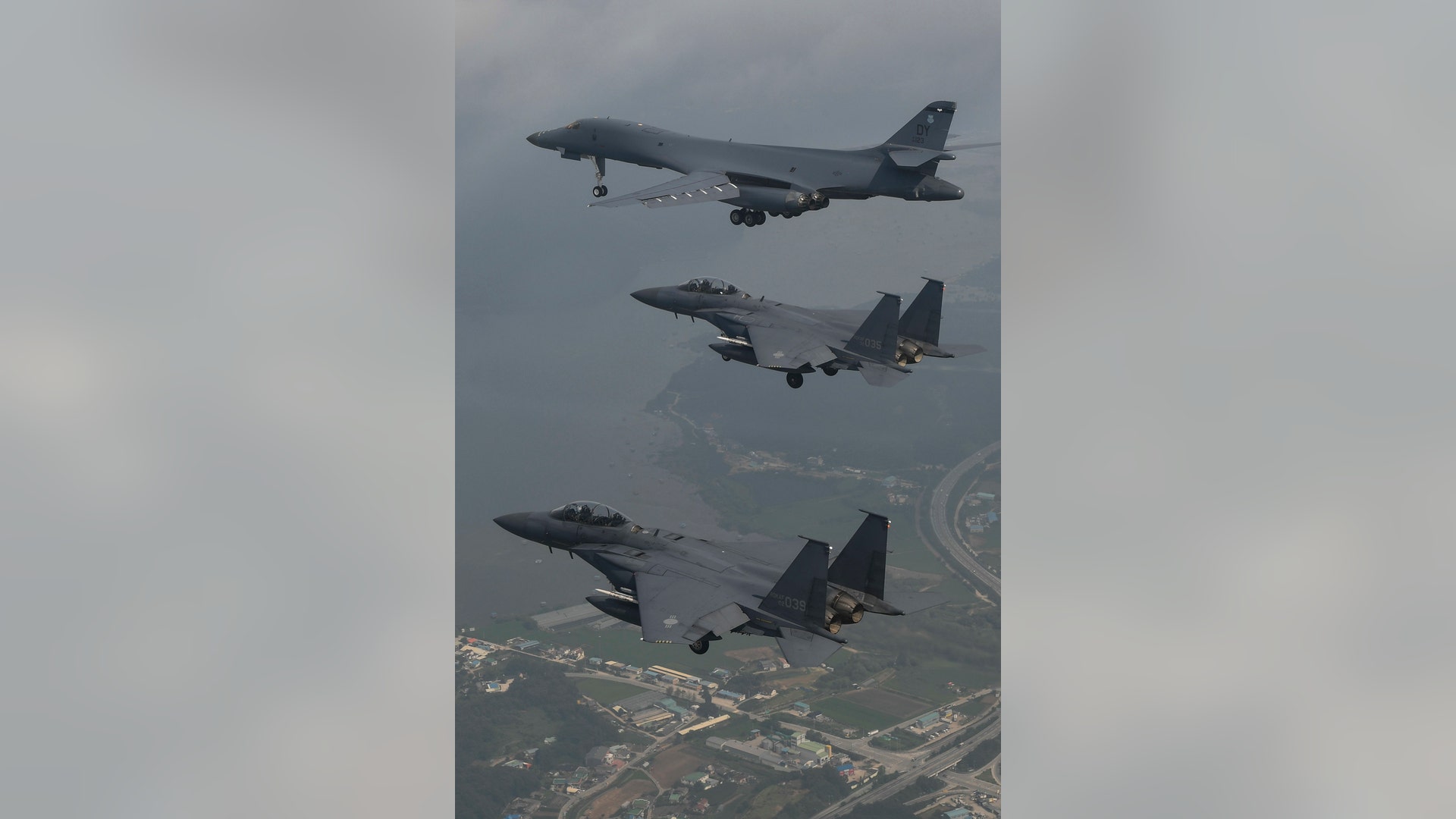 A U.S. Air Force B-1B Lancer is joined by Republic of Korea Air Force F-15 jets during a 10-hour training mission over the Korean Peninsula