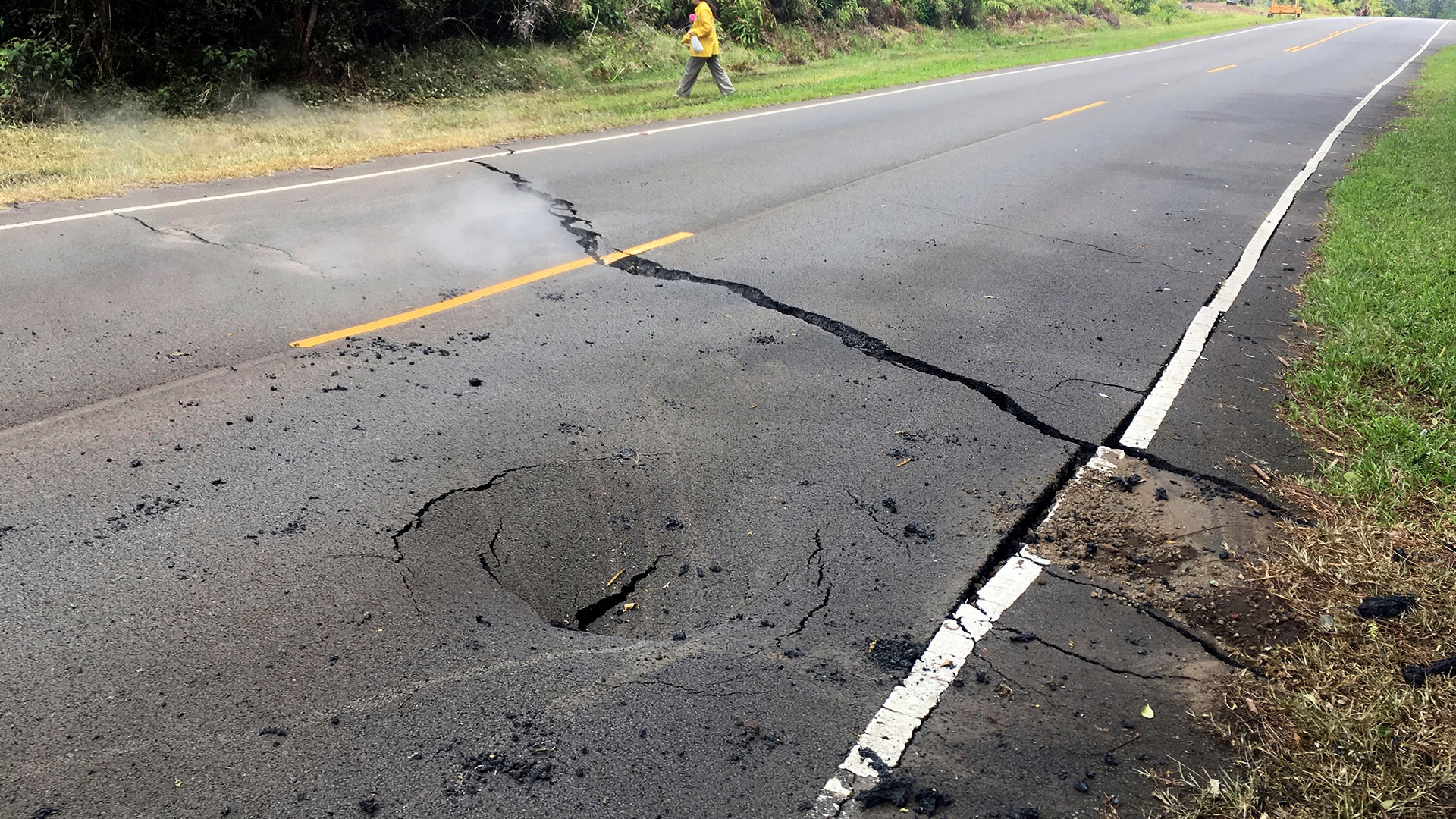 A crack in Pohoiki Road just east of Leilani Street in the Leilani Estates subdivision in Pahoa, Hawaii, May 5, 2018