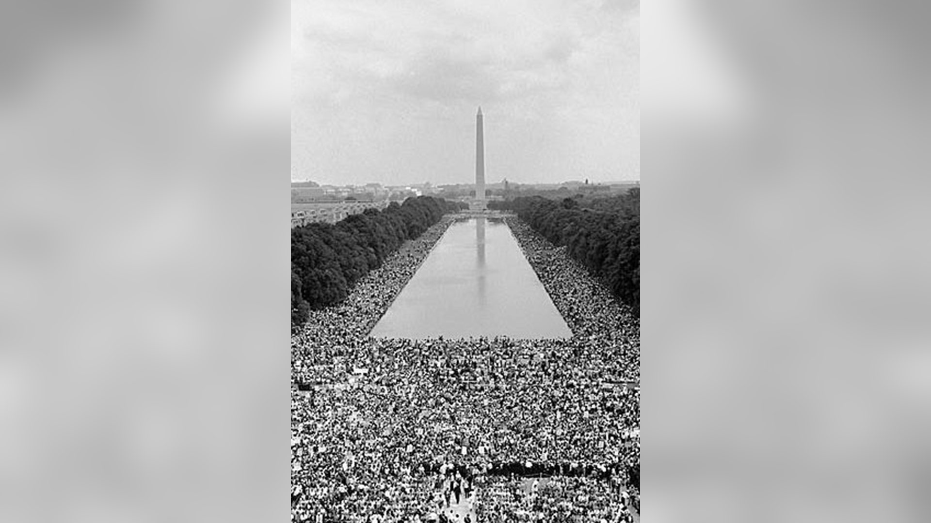 People watch Dr. Martin Luther King, Jr. deliver his 