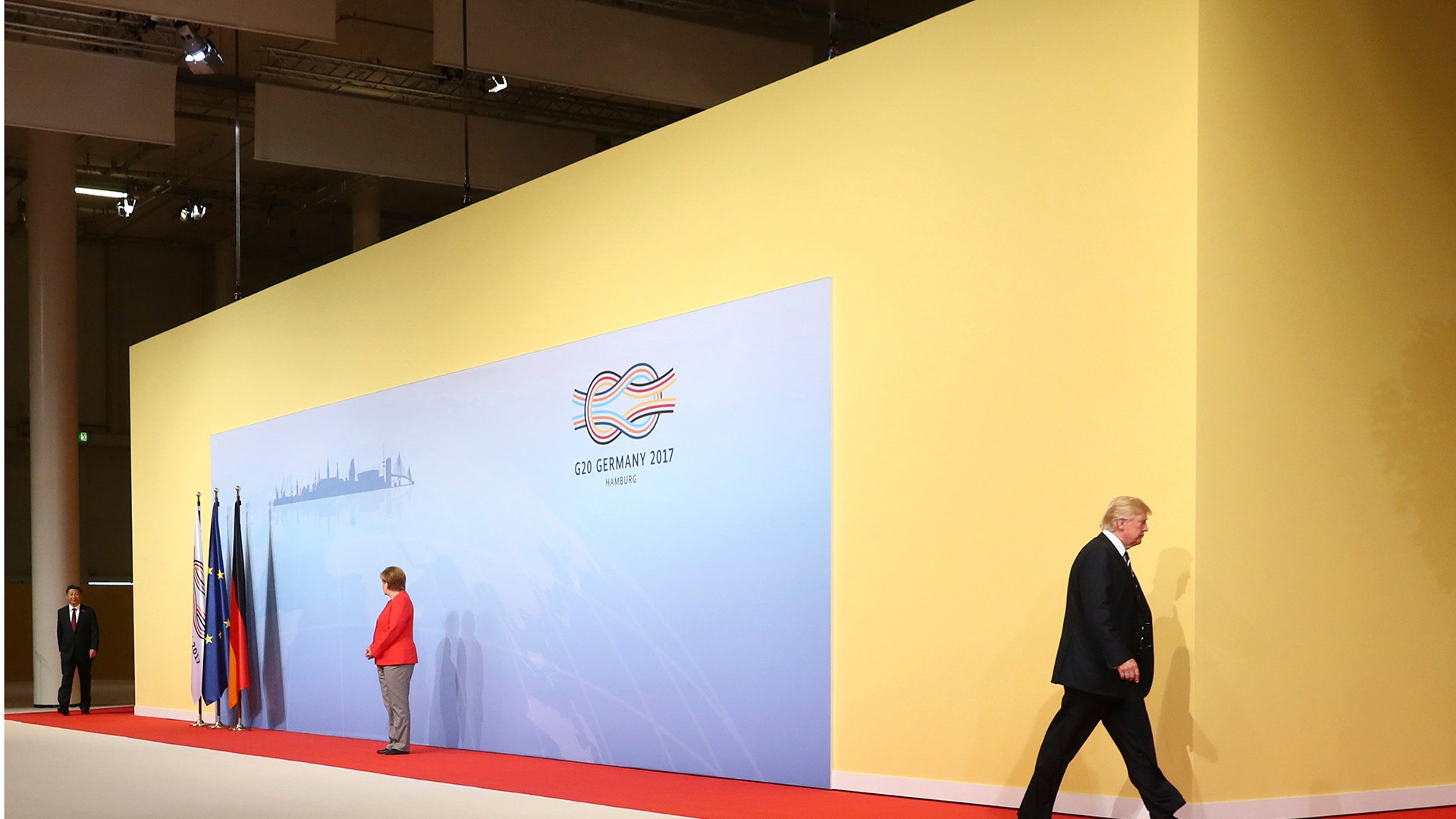U.S. President Donald Trump leaves the welcoming ceremony with German chancellor Angela Merkel at the G-20 summit in Hamburg, Germany
