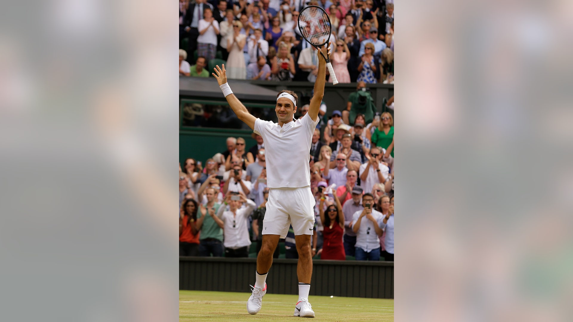 Switzerland’s Roger Federer celebrates winning the men's Wimbledon title against Croatia’s Marin Cilic in London