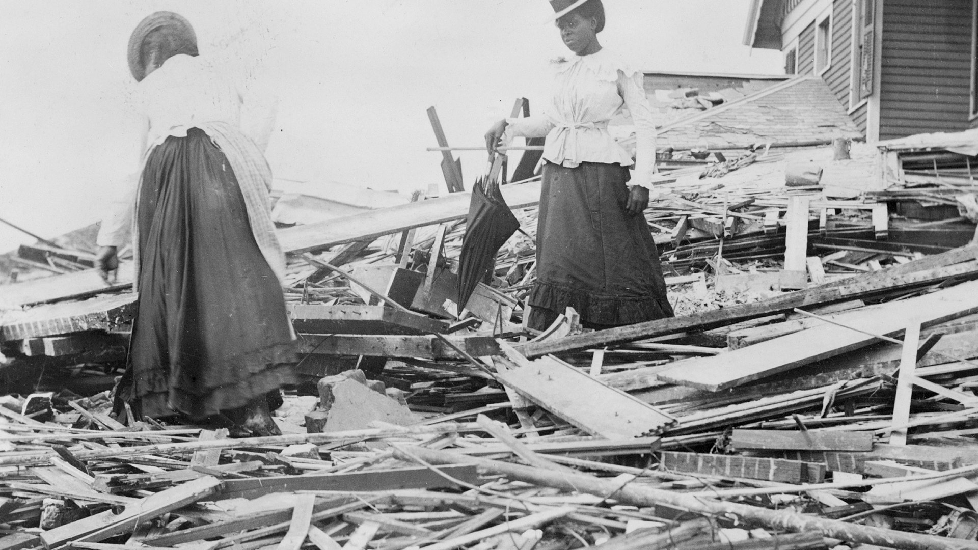 Two women search through rubble following a violent hurricane which devastated most of Galveston and took more than 5,000 lives