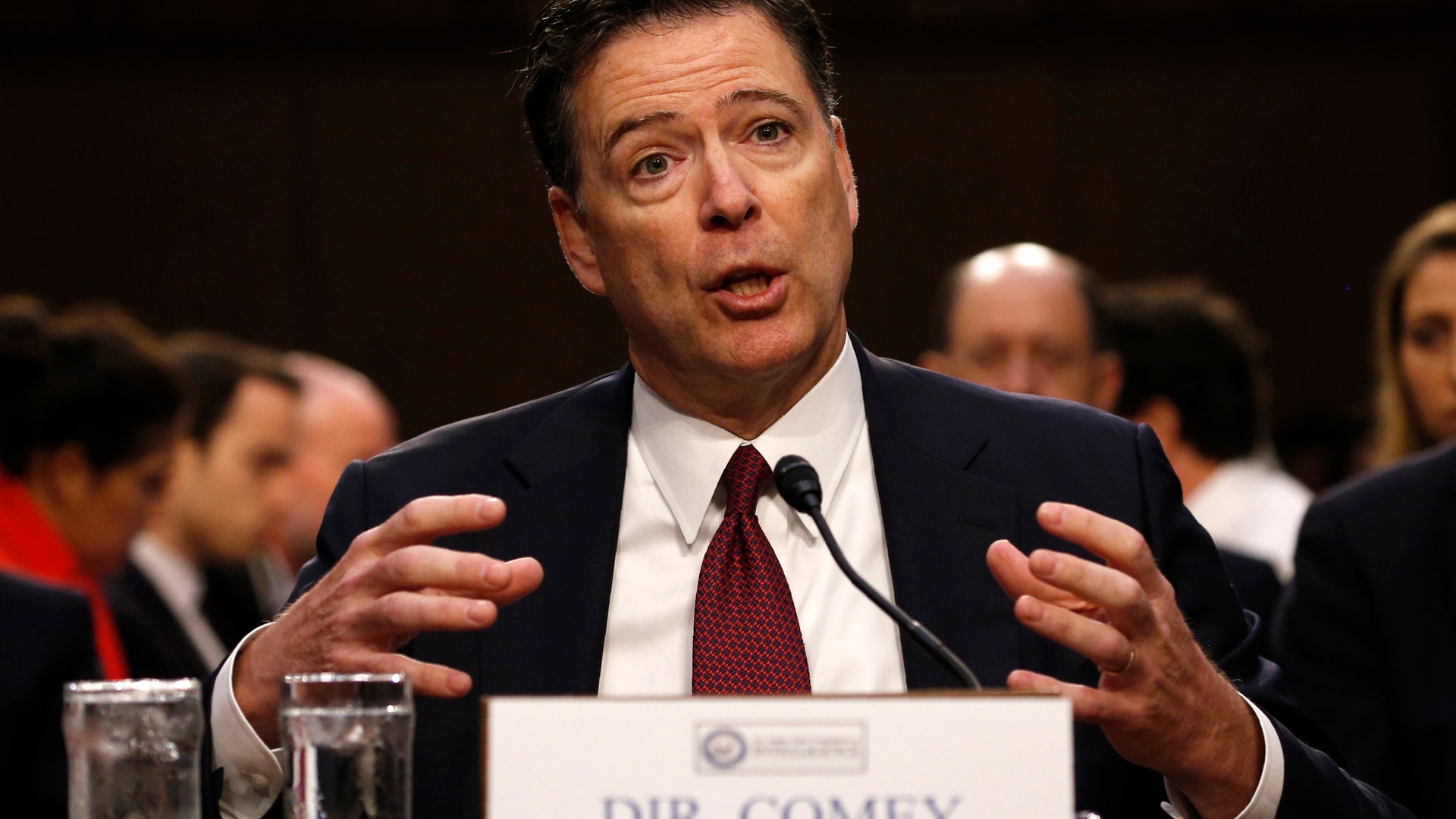 Former FBI Director James Comey testifies before a Senate Intelligence Committee hearing in Washington