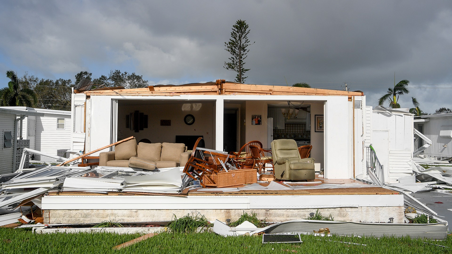 A trailer home with a front ripped off by Hurricane Irma winds is seen near Naples, Florida, Monday
