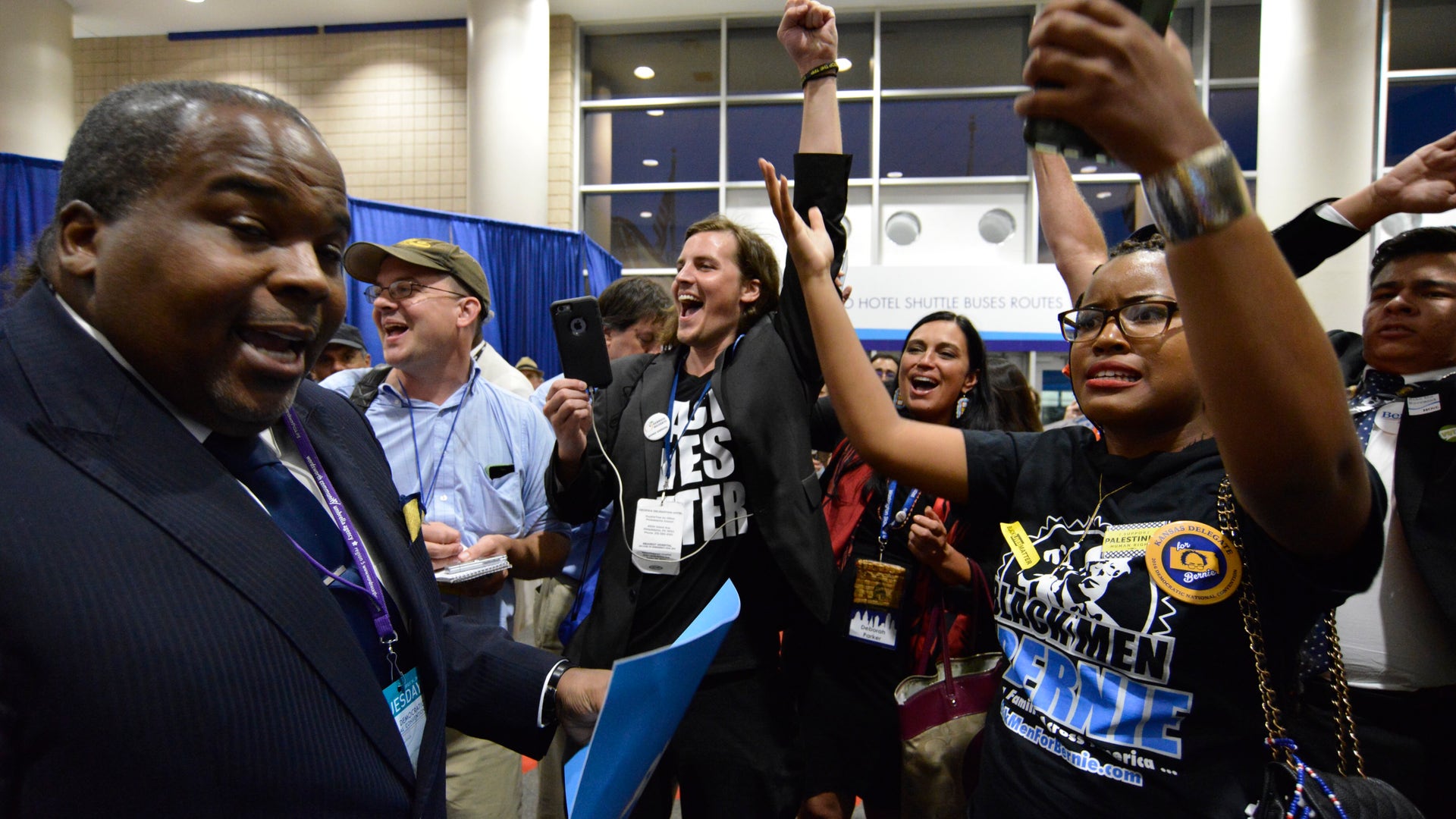 Bernie Sanders and Black Lives Matter protesters demonstrate in a media tent after Hillary Clinton is declared the nominee.