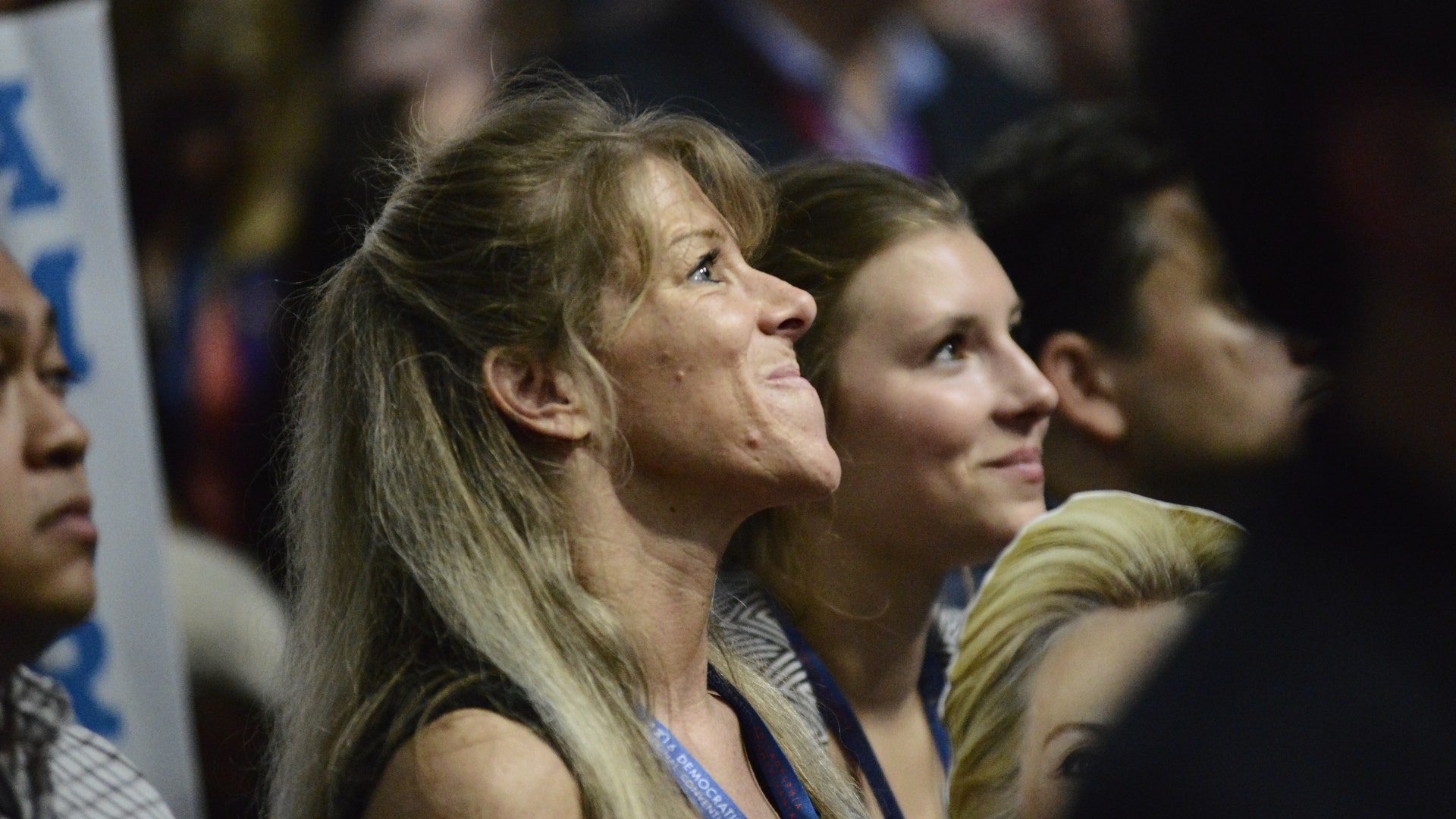 Supporters watch former President Bill Clinton address the crowd.