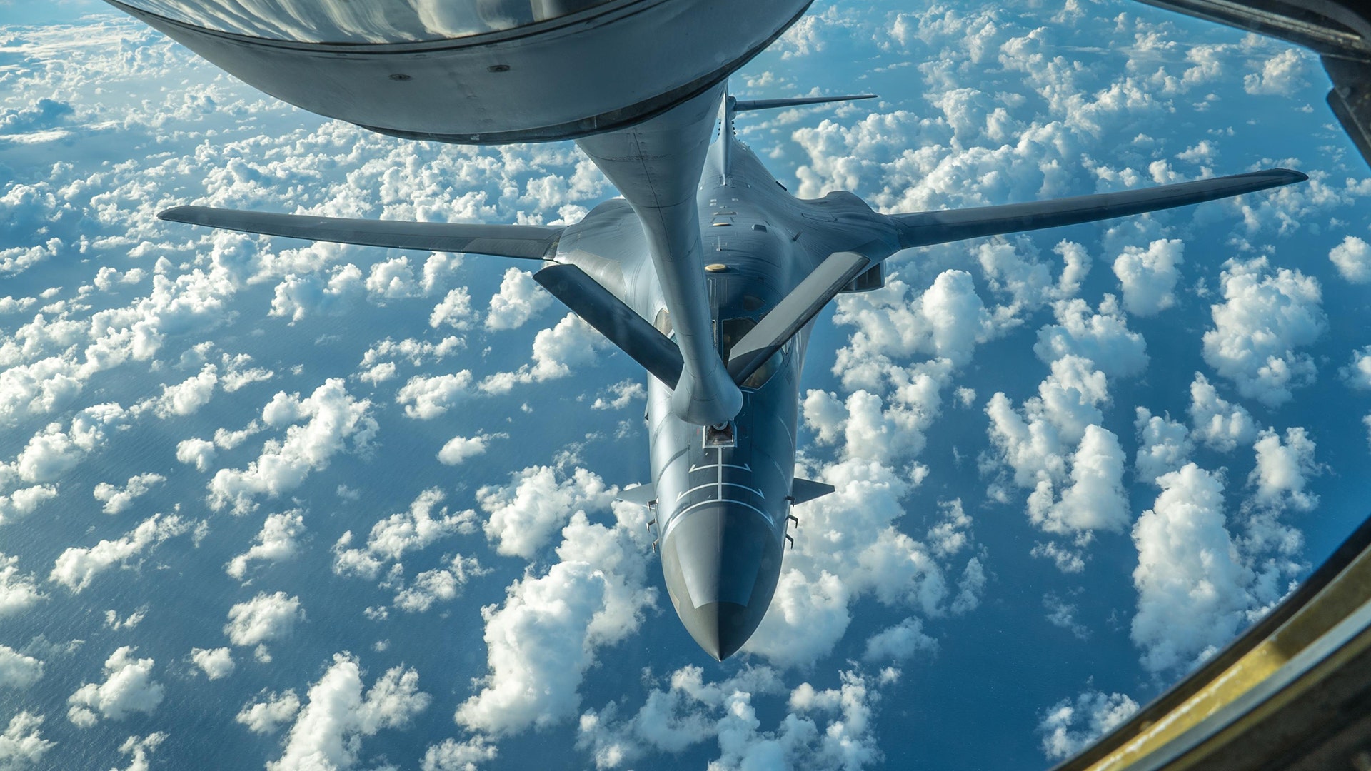 A U.S. Air Force B-1B Lancer receives fuel from a KC-135 Stratotanker during a 10-hour training mission over the Korean Peninsula