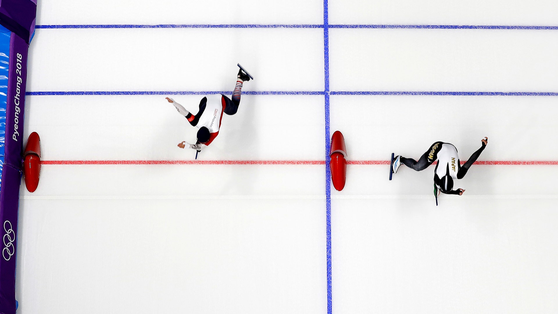 Japan's Nao Kodaira, right, sets a new Olympic record during the women's 500 meters speedskating race at the 2018 Winter Olympics
