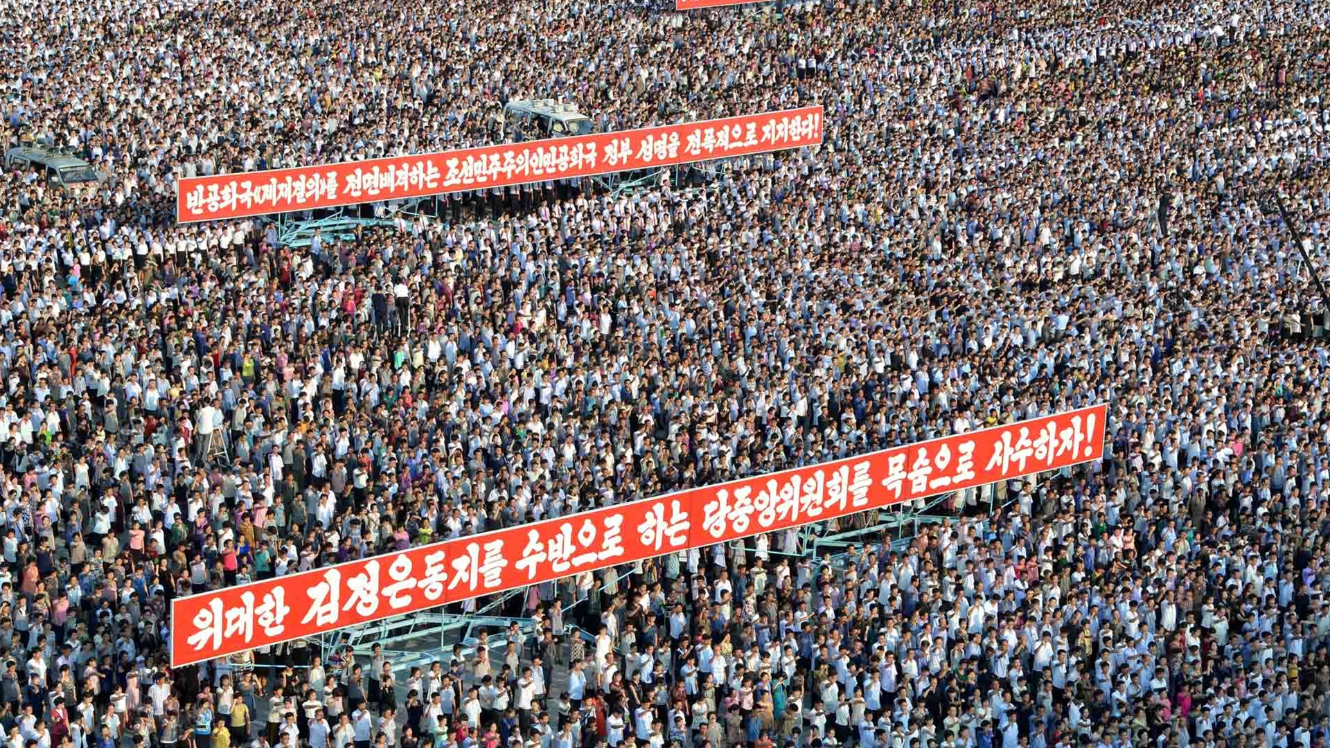 Banners displayed at a rally at Kim Il Sung Square in Pyongyang, North Korea, August 9