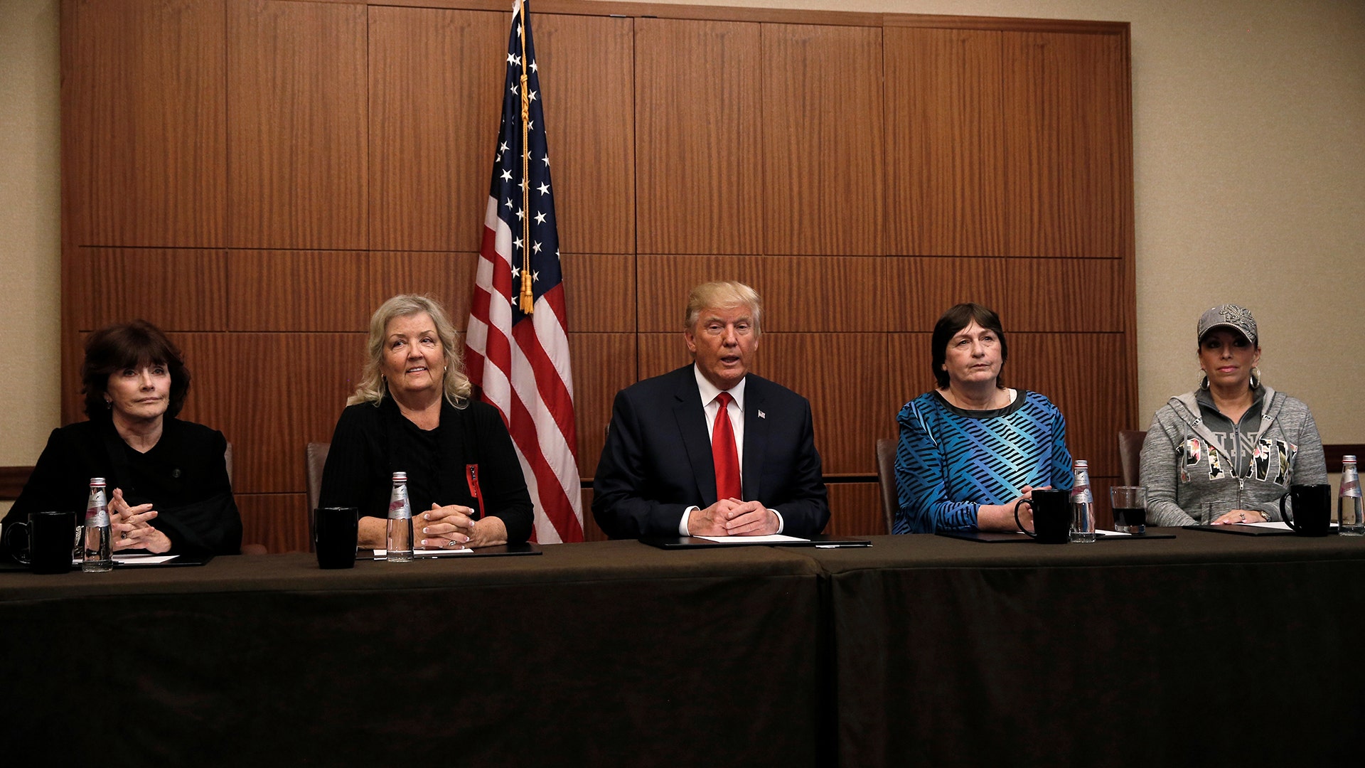 Presidential nominee Donald Trump sits with (R-L) Paula Jones, Kathy Shelton, Juanita Broaddrick, Kathleen Willey in St. Louis, October 9, 2016